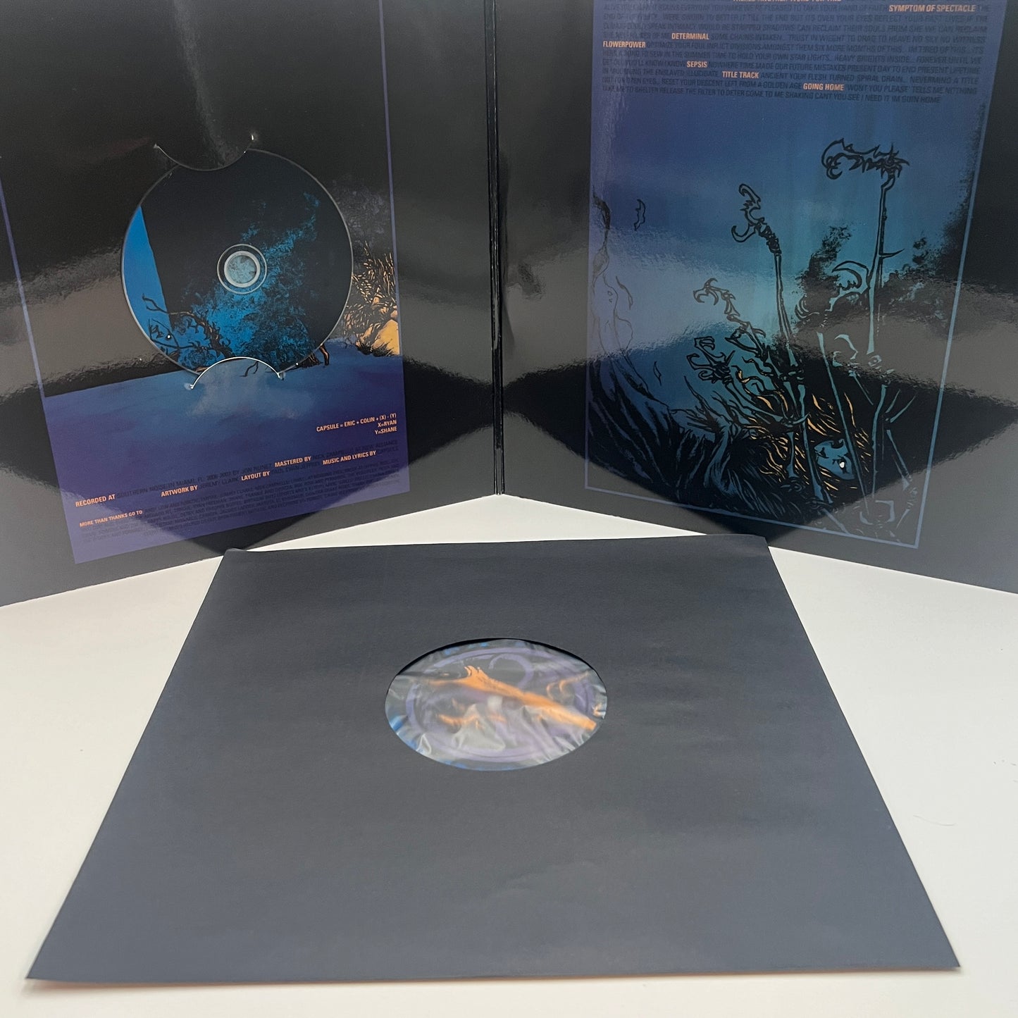 Capsule - Blue Vinyl LP Transparent Blue w/ Black Splatter